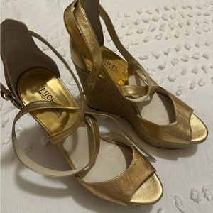Micheal Kors gold wedges